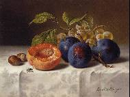 A peach, grapes and plums on a white tablecloth on a ledge