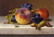 Peaches, grapes and plums on a marble ledge