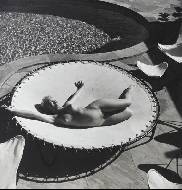 Marilyn Monroe lying naked on a trampoline, 1953