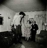 A Jewish Giant at home with his parents in the Bronx, New York