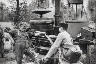 Distiller and postman, 1950s